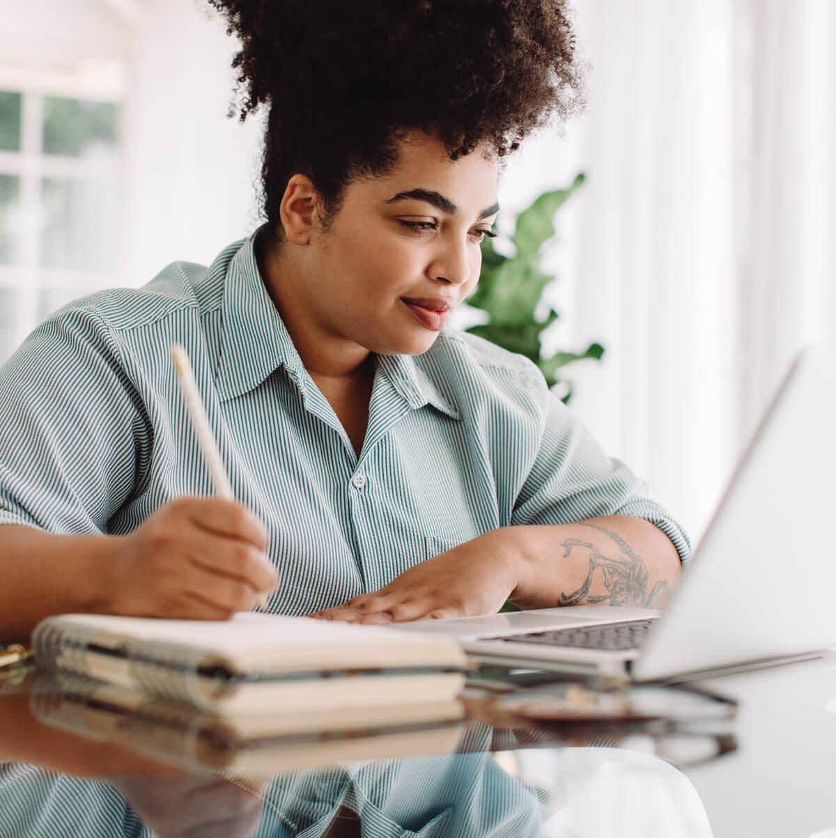 Lady working on laptop.