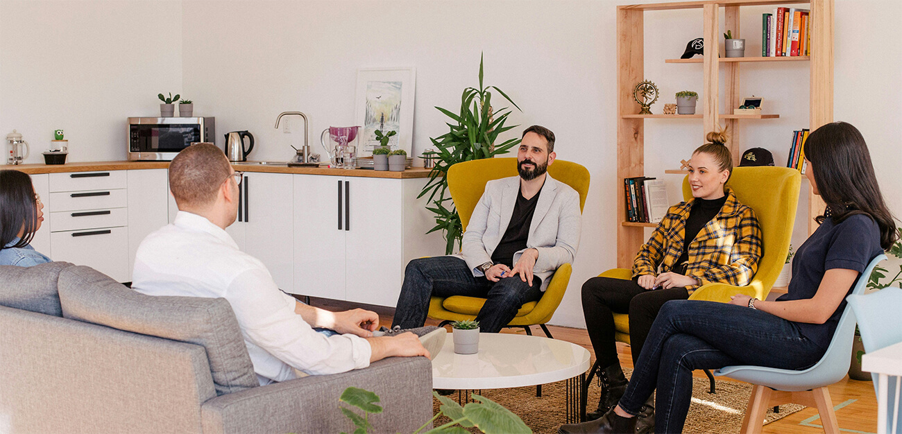 A group of individuals speaking with one another.