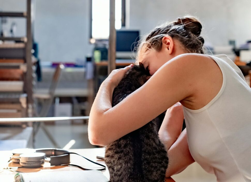 Person embracing their emotion support animal